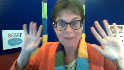 Educator waving as she delivers a SCARF Live Online workshop