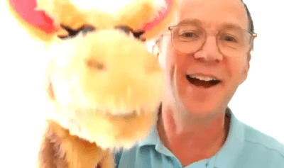 Educator, Guy, with Harold the giraffe.