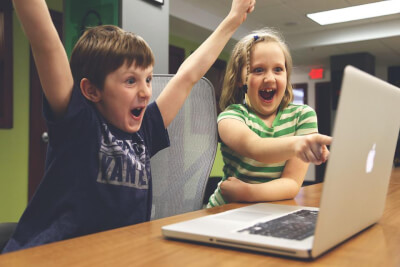 Two children celebrating success